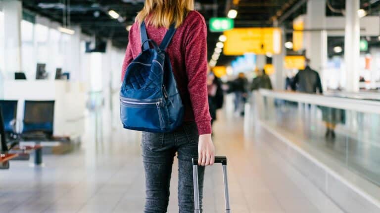 Girl-With-Luggage-Inside-The-Airport